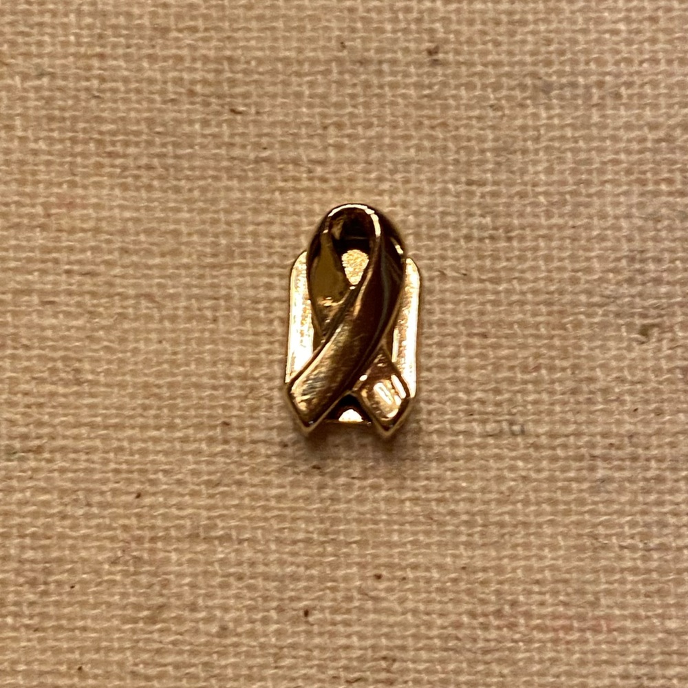KEEP Collective gold ribbon for childhood cancer